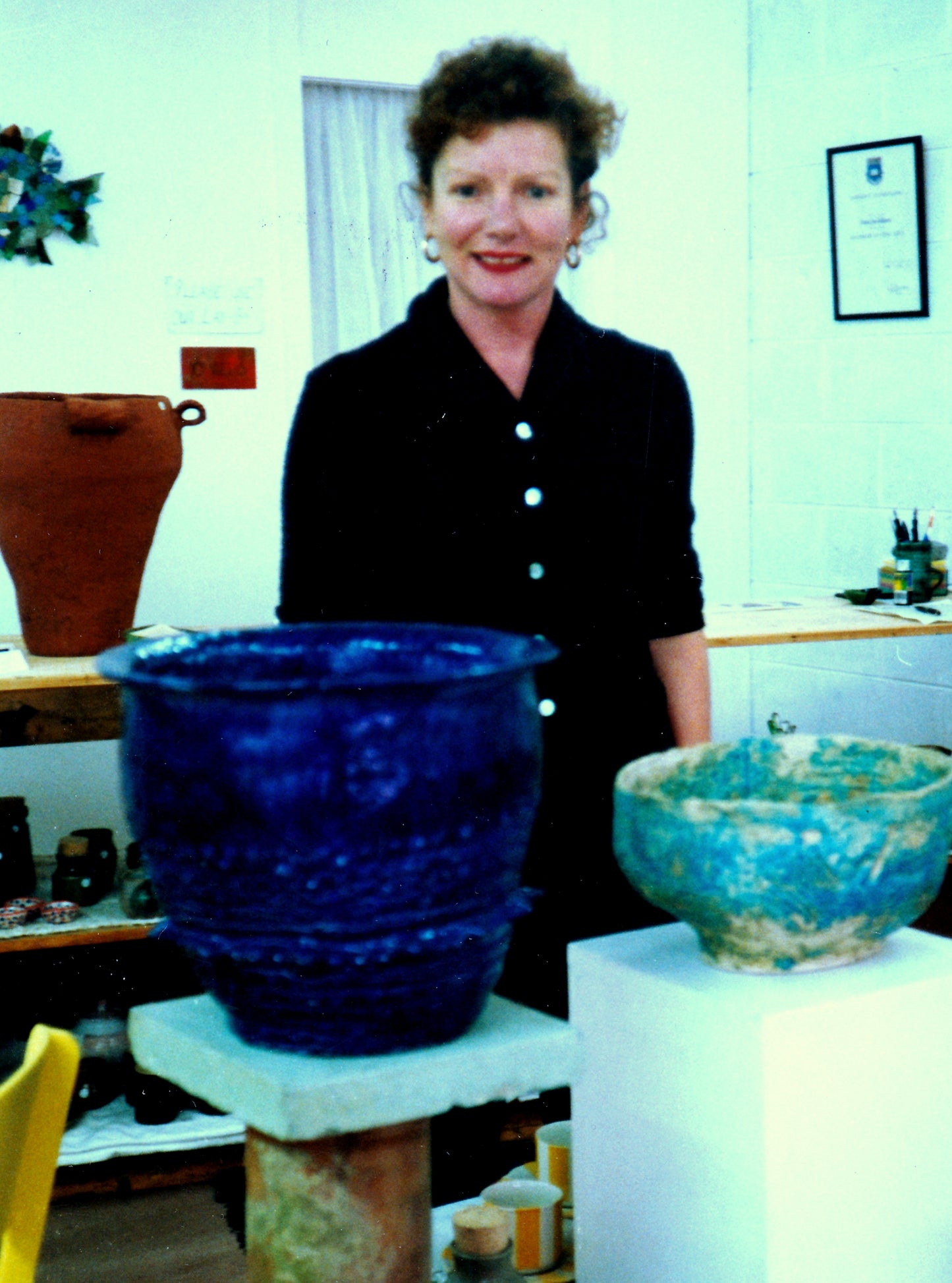 The artist with two glazed pots. 1990's